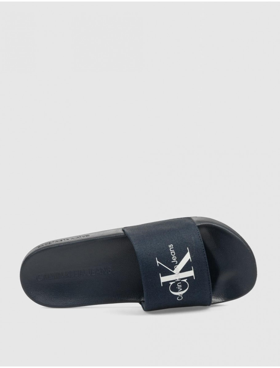 CHANCLA CALVIN KLEIN SLIDE MONORAM CV MARINO