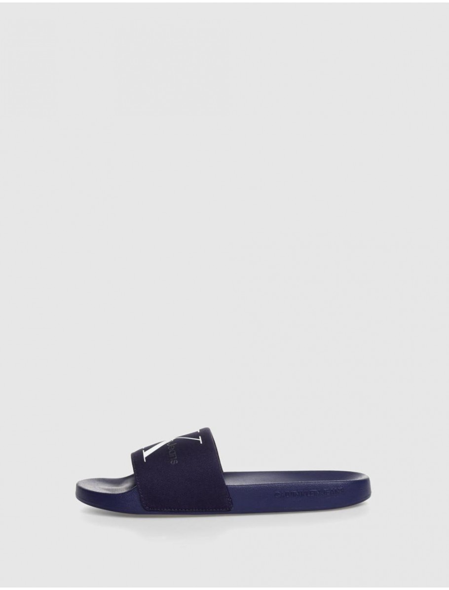 CHANCLA CALVIN KLEIN SLIDE MONORAM CO MARINO